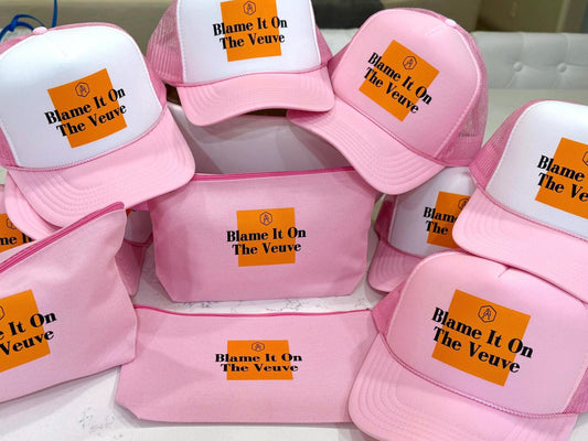 “Blame It on the Veuve” champagne-themed trucker hat with foam front and mesh back—perfect for birthday parties, bachelorette weekends, and celebratory toasts.